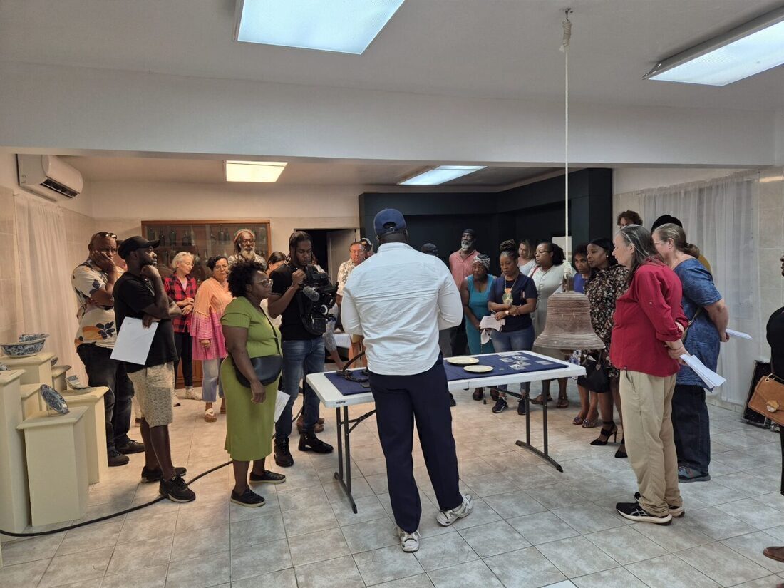Members of the community gather in the Heritage House to view the artefacts found with the archaeologically excavated 69 ancestral remains